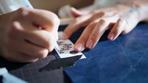 Tattoo Artist Fingers Drawing Pen at Home Close Up Woman Transferring Pattern