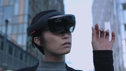 Woman Wearing Augmented Reality Headset in Urban Setting