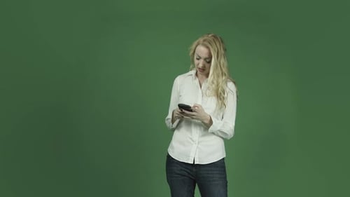 caucasian woman isolated on chroma green screen background upset sad cell phone