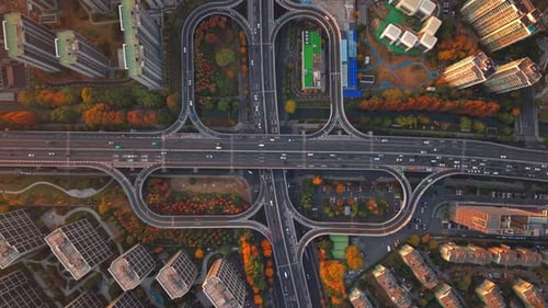 Aerial Shot of Complex Freeway Interchange with Flowing Traffic in Hangzhou China During Sunset