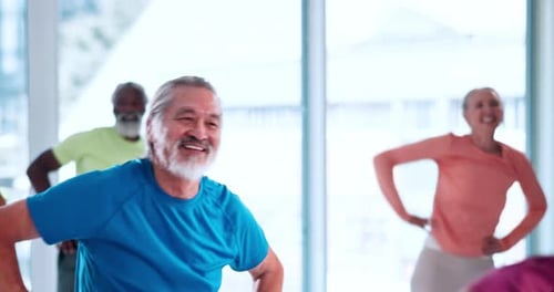 Active Seniors Exercising with Group in Bright Room