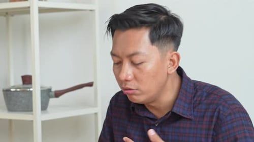 Adult Experiences Heartburn While Eating in Home