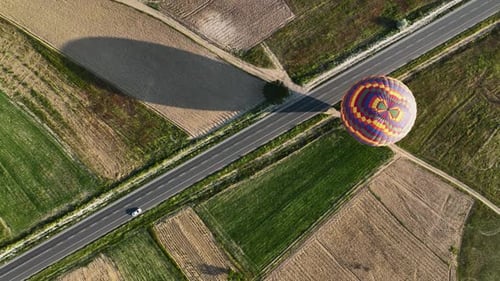 Hot Air Balloons Fly Over the Mountainous Landscape of Cappadocia Turkey