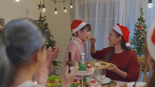 Family Enjoys Christmas Dinner Together at Home