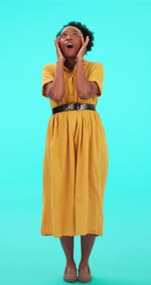 Surprised Woman Looking Upward in Studio