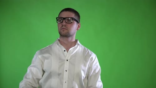 A Textured Man with Bristles and Glasses Controls His Hands with a Hologram on a Green Background