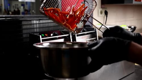 Preparing Delicious Golden French Fries in Commercial Kitchen