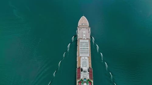 Cruise ship heading out on a luxury vacation voyage - straight down aerial view