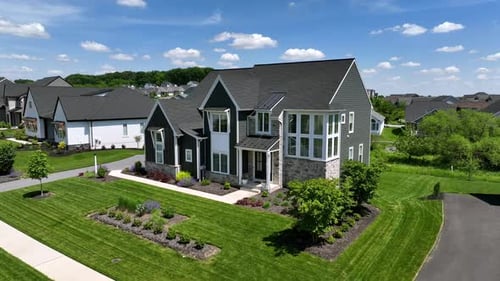 Modern Single family home with neat green garden in american suburb neighborhood. Sunny day in summe