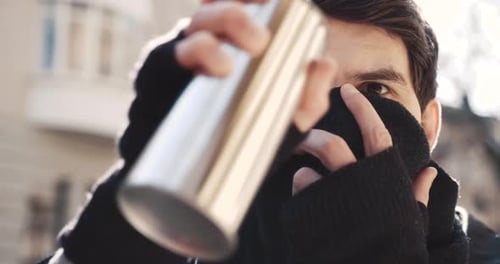 A Thoughtful Young Man in a Bustling City Immersed in Introspection Amid Vibrant Life