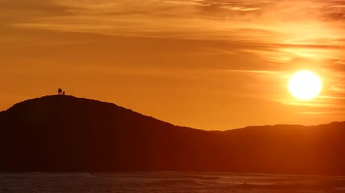 Sunset Sky with People on Hill