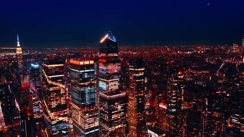 Rising above the downtown of stunning New York at night. Splendid view of American metropolis