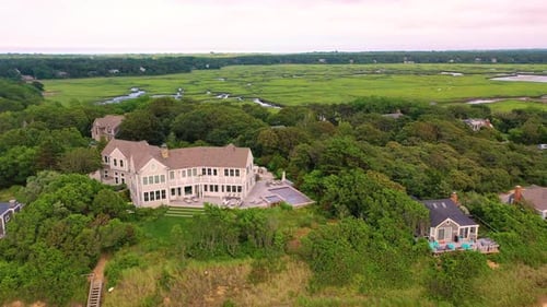 Aerial View of Homes Along Beach and Marsh