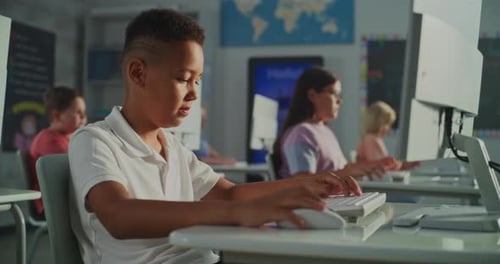 Children use computers in bright modern classroom