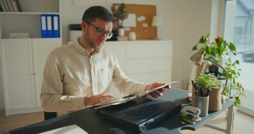 Businessman Planning Strategy Sitting at Desk