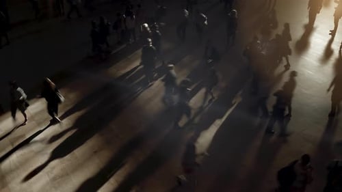 Aerial view of busy urban intersection with pedestrians