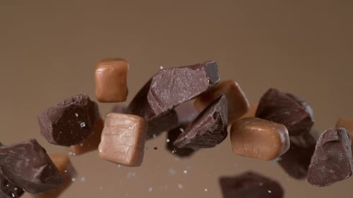 Chocolate Chunks and Caramel Pieces Floating in the Air