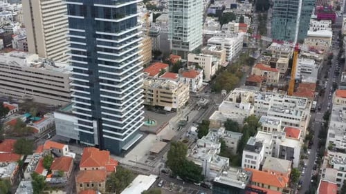 Aerial Shot Of Downtown District In Residential City, Drone Flying Over Cars Moving On Road