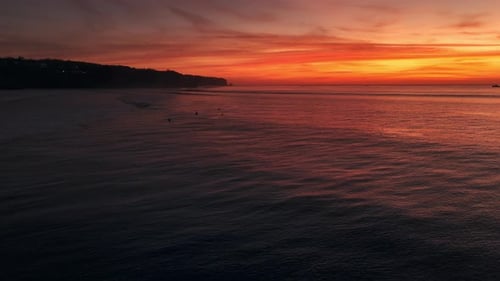 Evening Sunset with Perfect Surfing Waves on Bali Beach Drone View