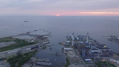 Aerial Views Showcase Copenhagen's Industrial Harbor Illuminated By the Warm Hues of Sunset A