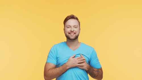 Expressive Young Man Over Vibrant Background Studio Portrait of Handsome Person