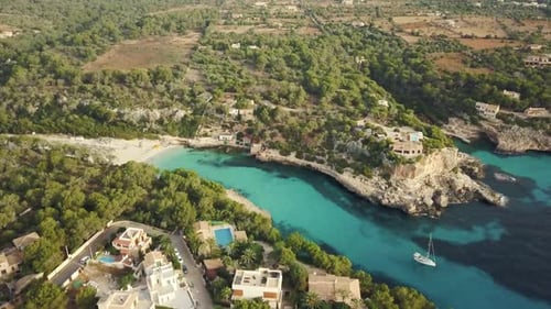 Stunning drone footage in 4k of the beautiful bay Cala Llombards in Mallorca - East coast - Empty wi