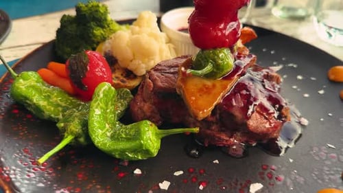 Tasty steak with vegetables on a plate