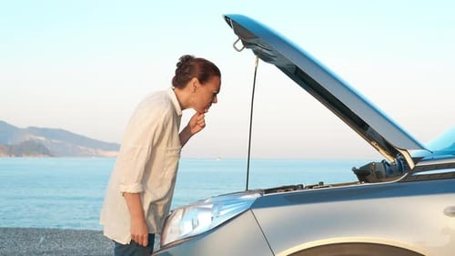 Confused Woman By Broken Car at Sea Traveling