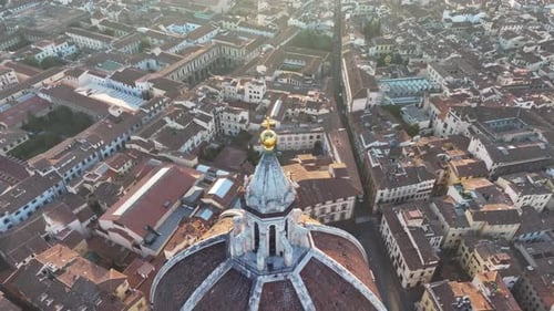 Florence Duomo and city panorama at golden sunrise morning haze aerial