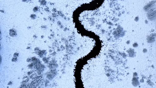 Snowy river in winter. Aerial view of wildlife, Poland