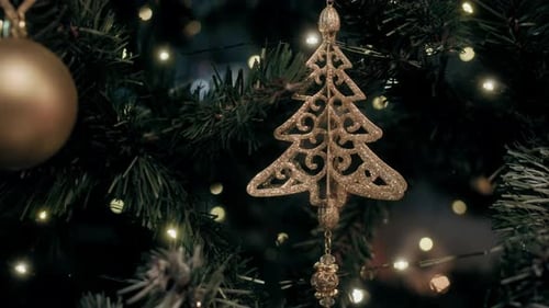 Christmas Tree with Gold Ornaments and Twinkling Lights