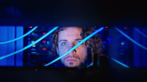 Man analysing servers in a data center