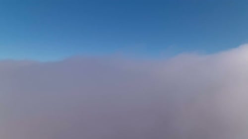 Drone rises above the clouds