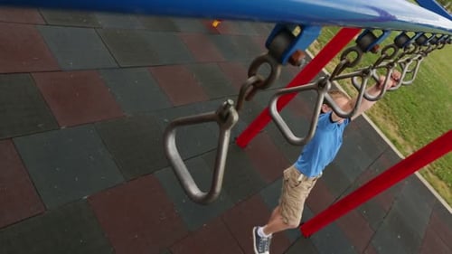 Boy Climbing At Playground