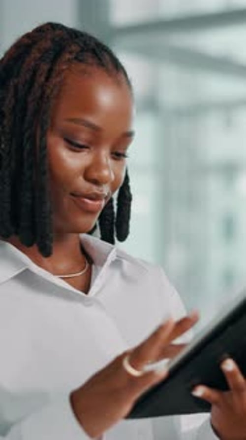 Happy, black woman and scroll with tablet in office, economy research or client portfolio