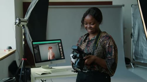 Portrait of African American Female Photographer in Studio