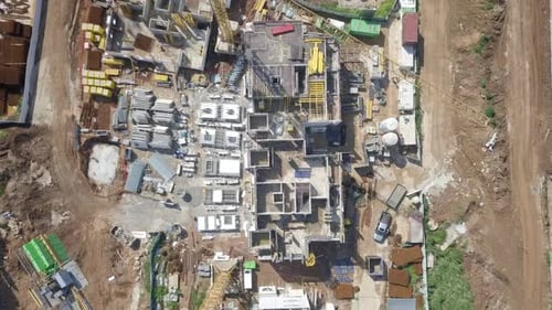 Large residential construction site with cranes, Aerial view