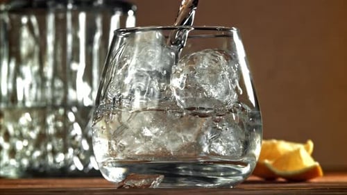 Refreshing Drink Poured into Glass of Ice