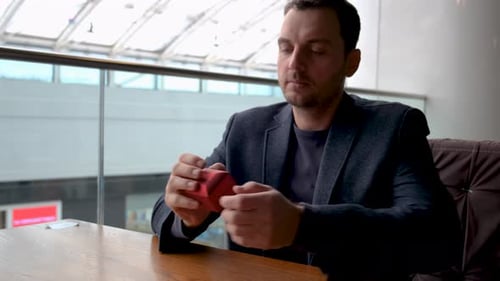 Man with Ring Box Anticipating Proposal Moment