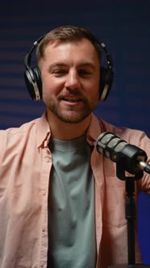 Man Speaking into Microphone in Recording Studio, Vertical