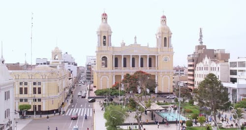 Amazing zoom in drone shot towards the famous cathedral in the center of Chiclayo, Peru during a clo