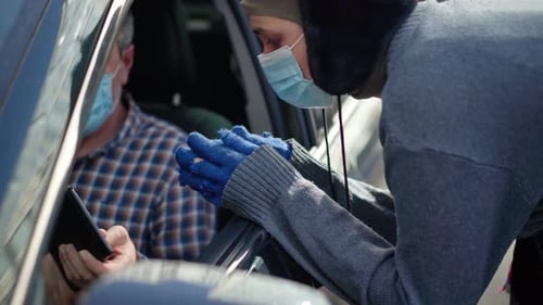 Young Homeless Woman in Coronavirus Face Mask Thanking Man for Money Leaving