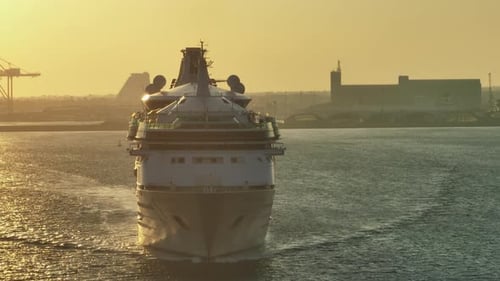 Aerial View of a Cruise Ship in the Sea at Sunset