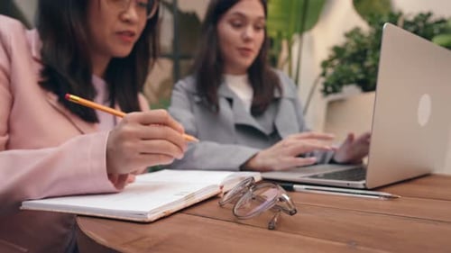 Young Adults Working Together on a Laptop Computer