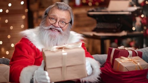 Portrait Smiling Santa Claus Giving Craft Gift Box Christmas Holiday Celebrate at Illuminated Room