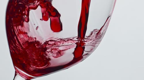 Pouring Red Wine into a Glass, Close Up