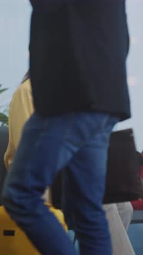 Woman Seated with Luggage Awaiting Departure Traveler Relaxing at Terminal with Backpack and