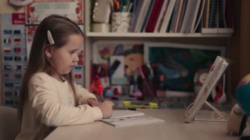 Little Girl Doing Homework at Desk
