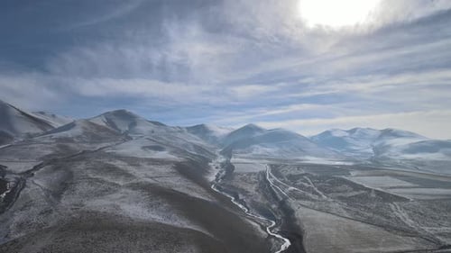 Aerial View of Snow Capped Winter Mountain Range