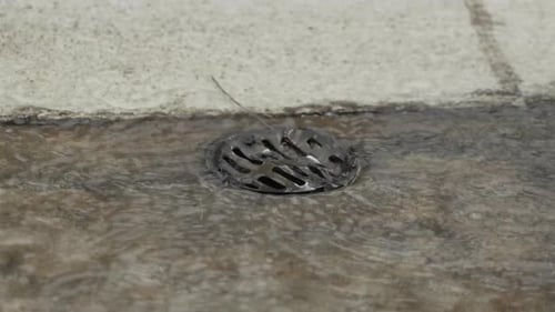 Heavy Rain Going Down Pool Drain